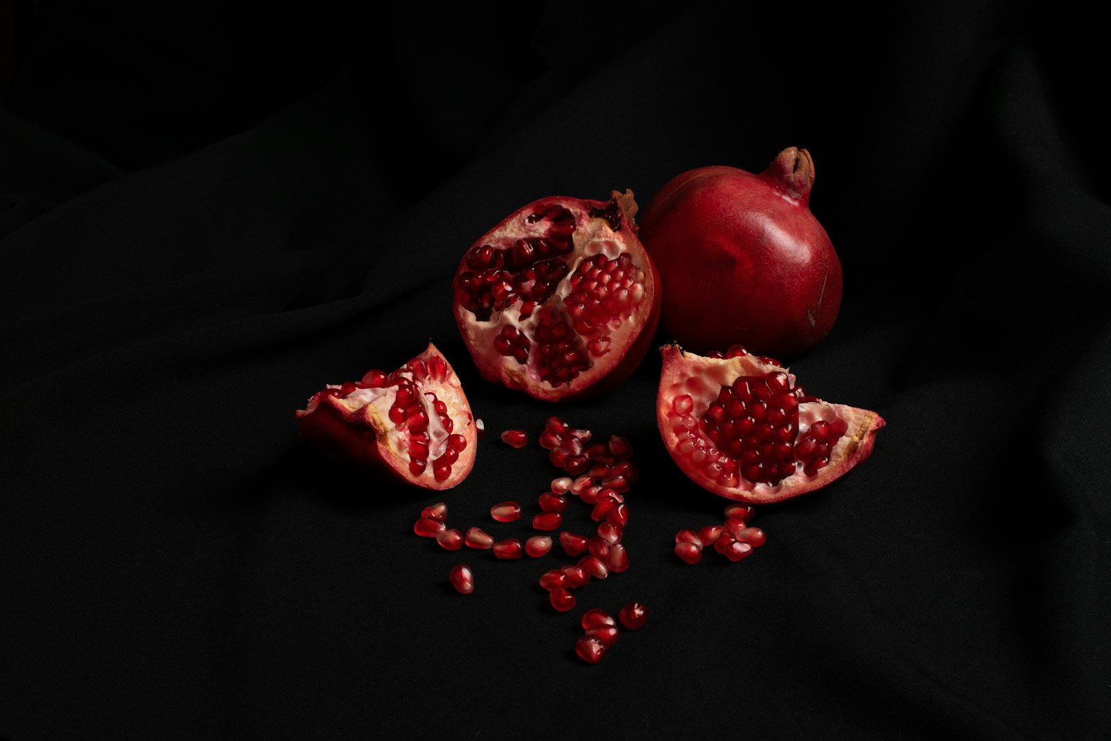 Open pomegranate with its red seeds, a seasonal autumn fruit